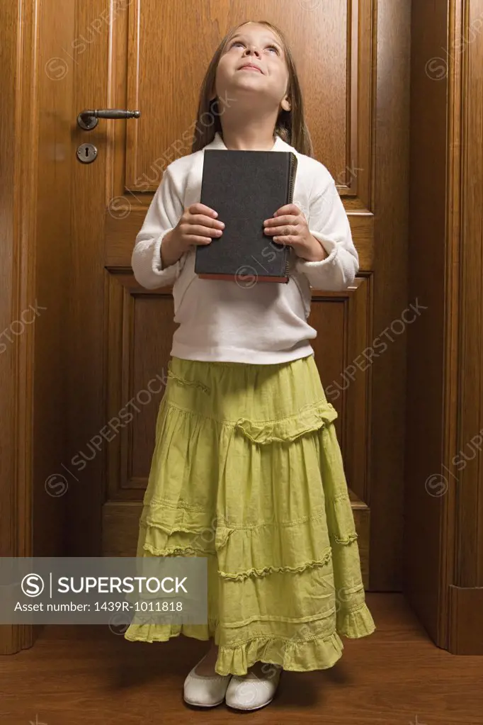 Girl holding the bible