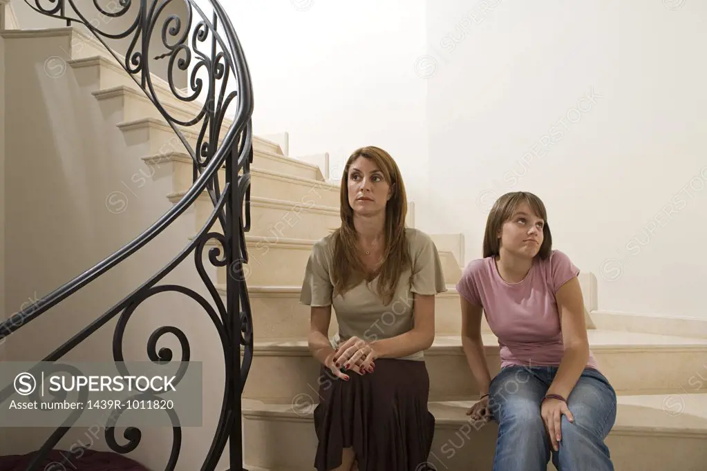 Mother and daughter on stairs