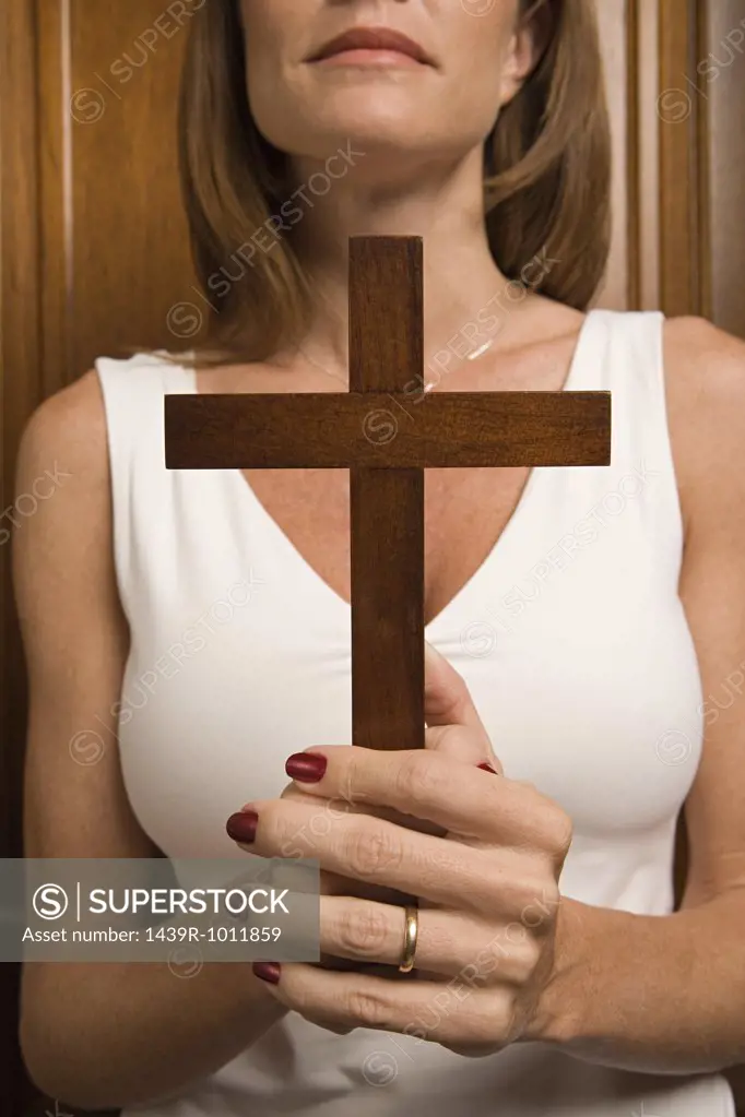 Woman holding a crucifix