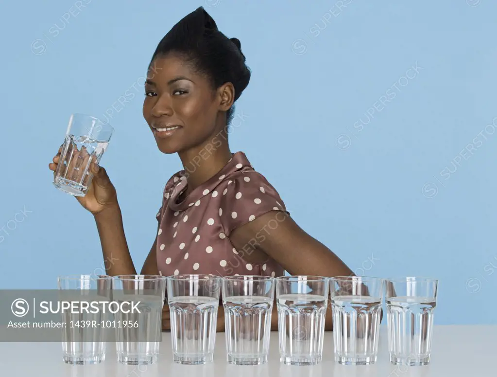 Young woman holding a glass