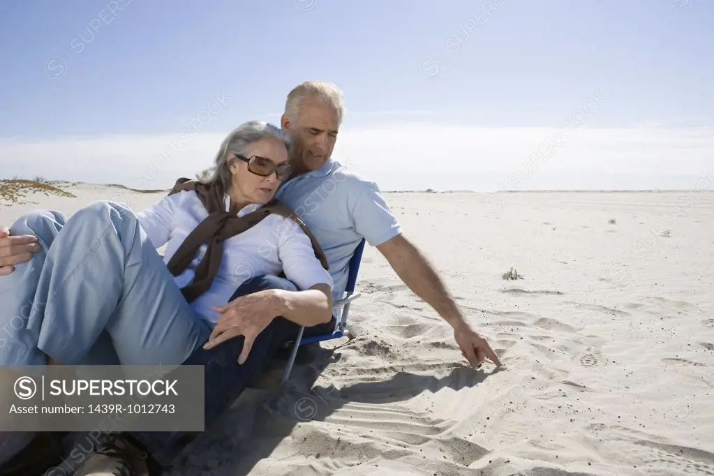 Senior couple relaxing on beach
