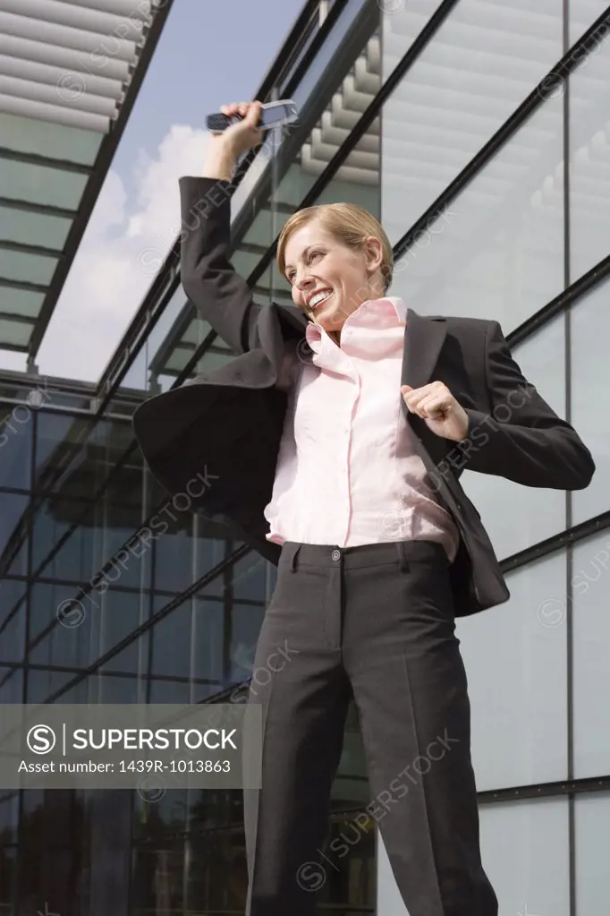 Businesswoman jumping outdoors