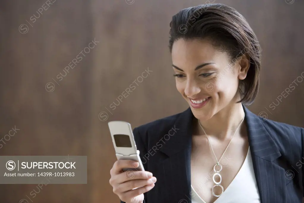 Young woman looking at mobile phone