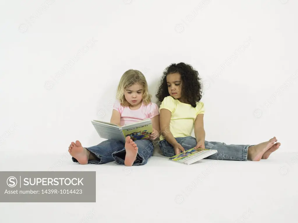 Girls looking at picture books