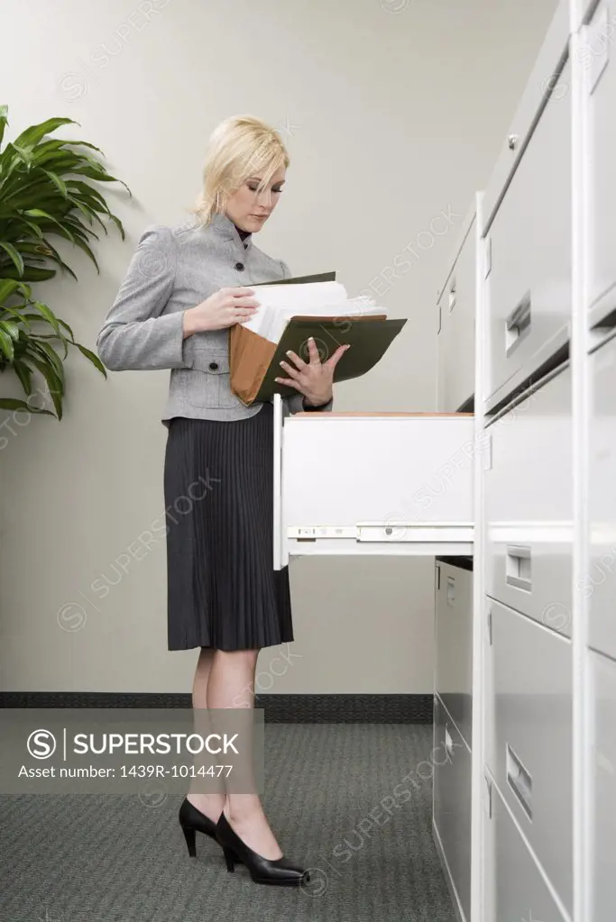 Secretary looking at files