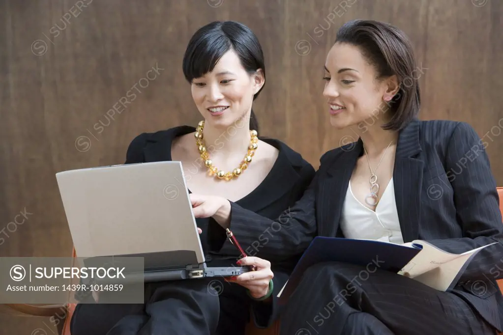 Two young women working