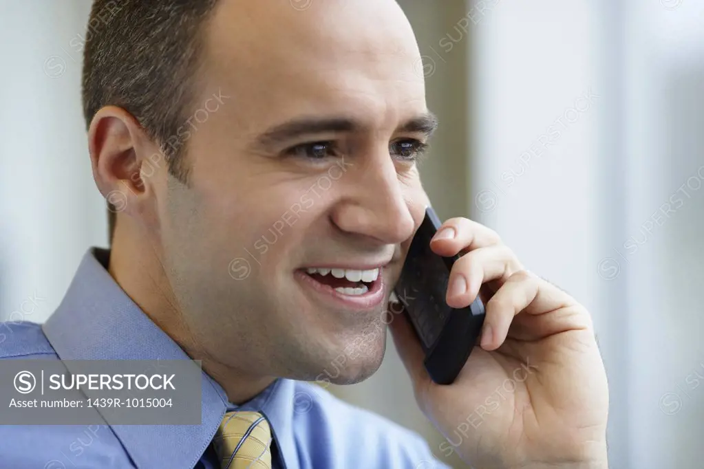 Businessman using a cellular telephone