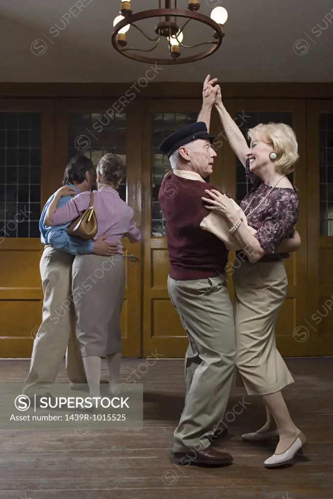 Senior couples dancing
