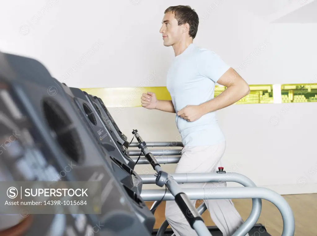 Man on treadmill in health club