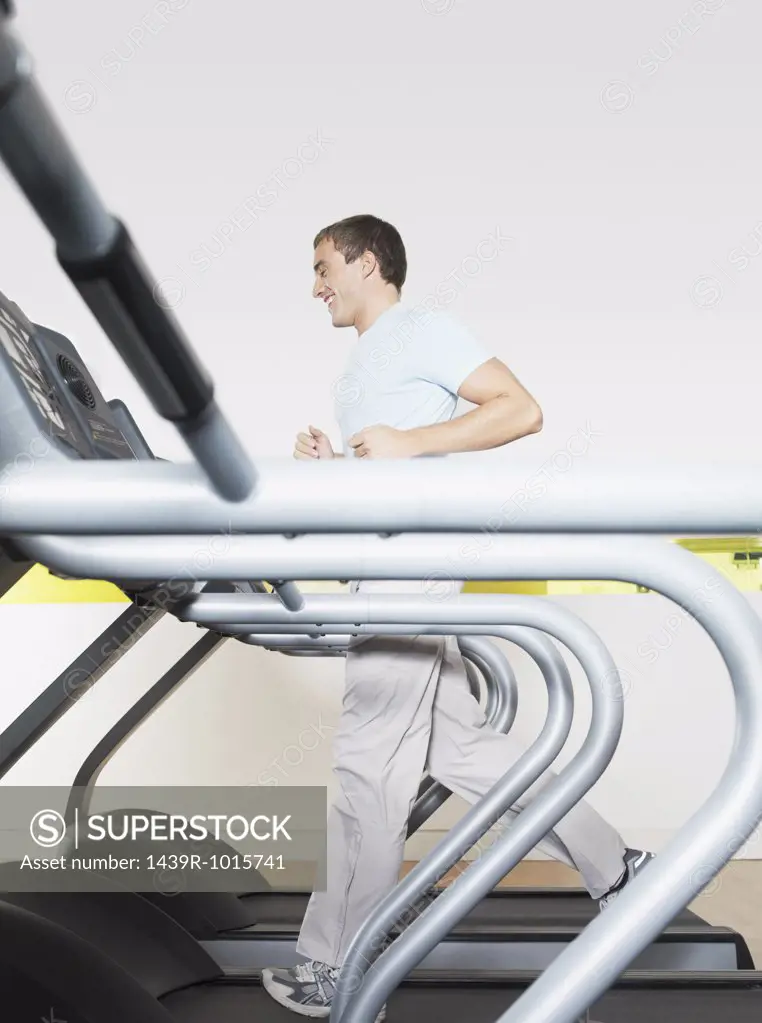 Man on treadmill in health club