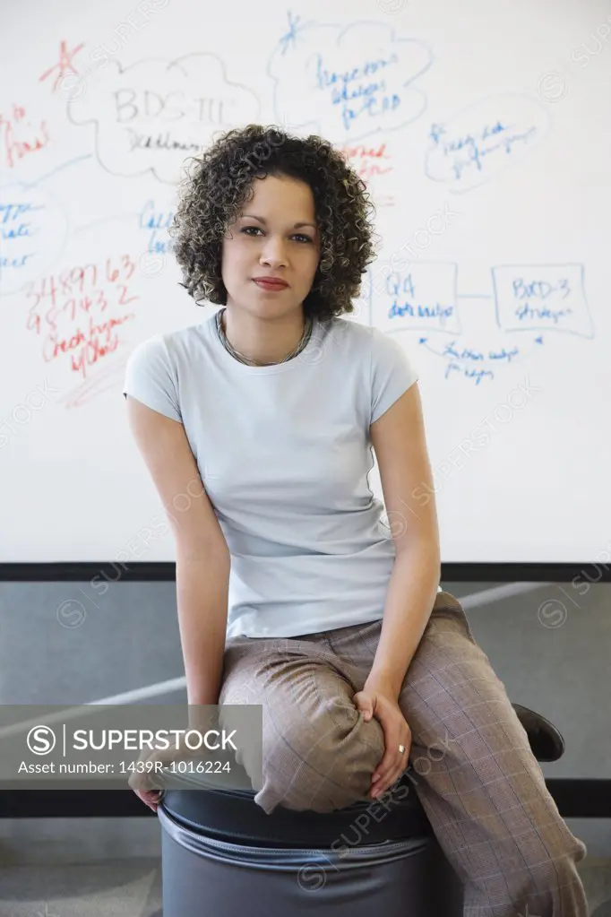 Woman in front of whiteboard