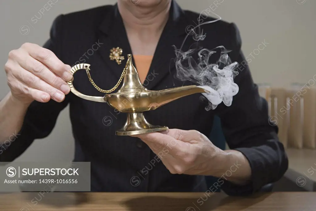 Woman holding genie lamp