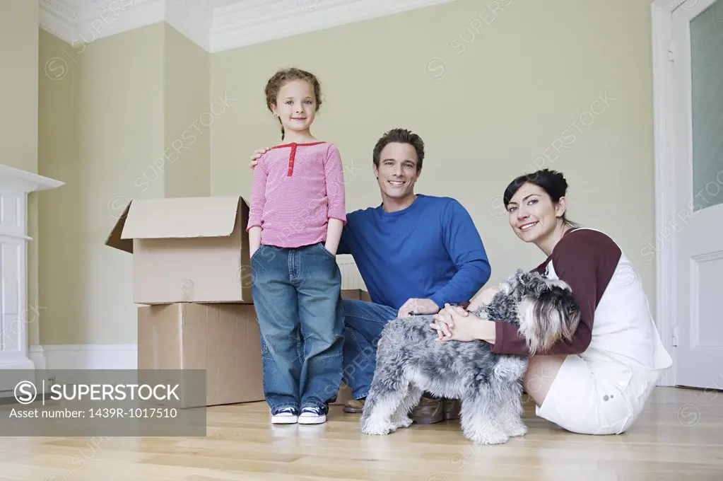 Family and dog in new house