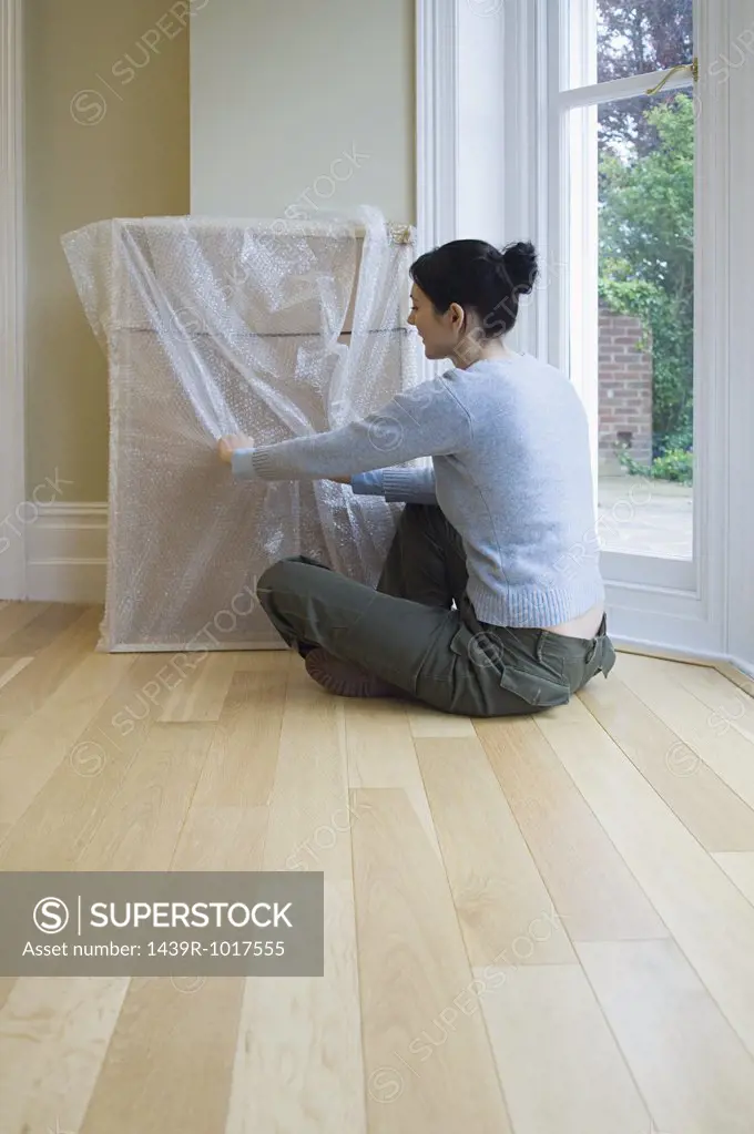 Woman unpacking picture
