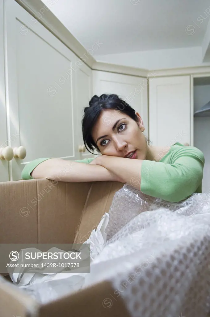 Woman tired of unpacking 