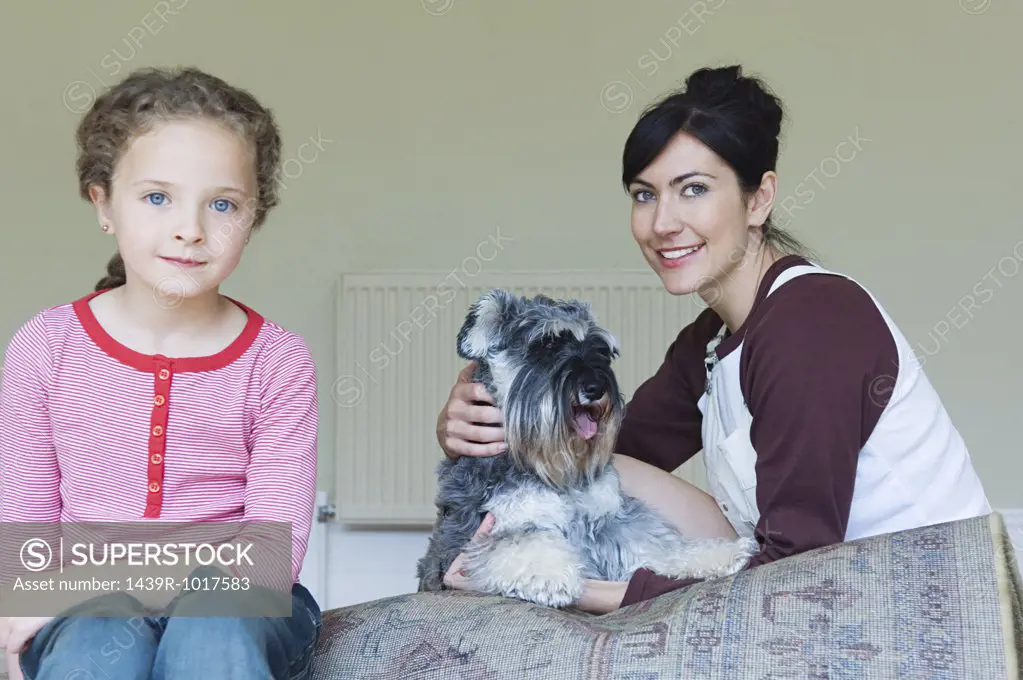 Mother and daughter with pet dog