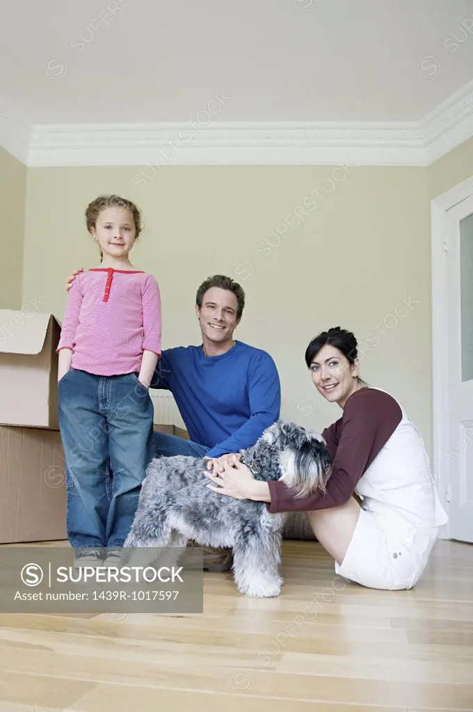 Family and dog in new house