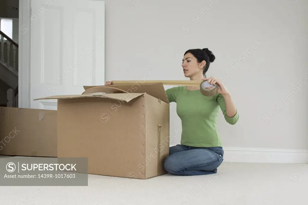 Woman packing up boxes