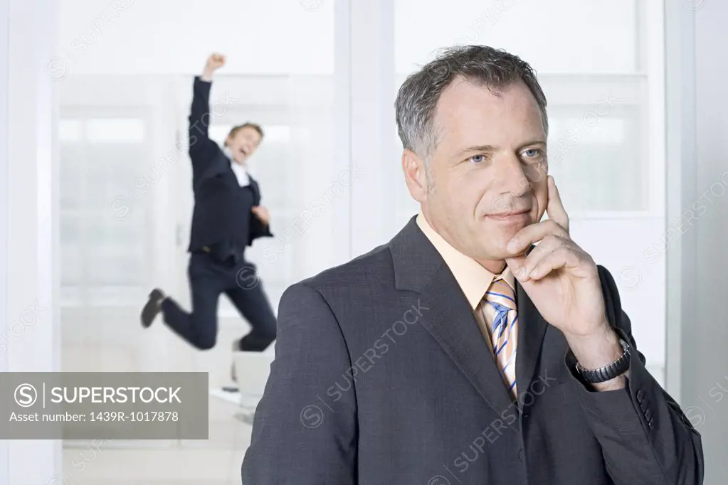 Businessmen thinking and jumping