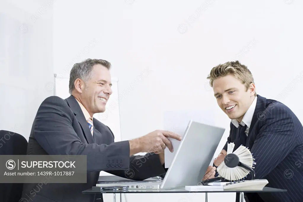 Businessmen sitting at desk
