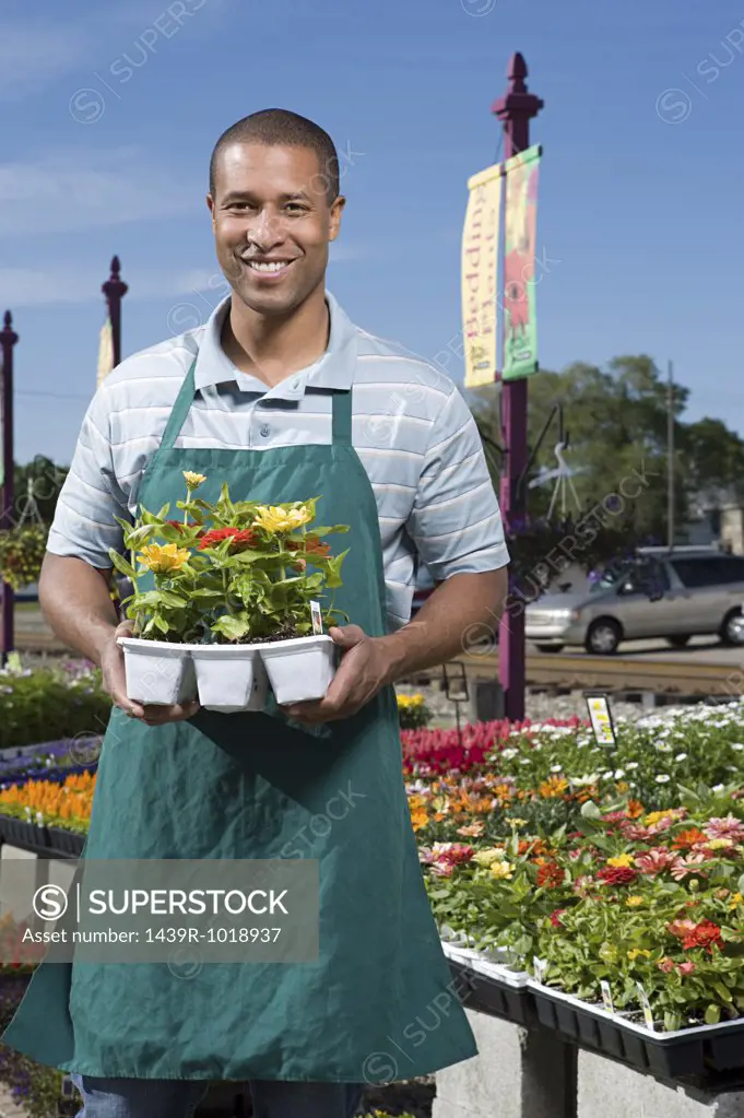 Shop assistant holding flowers