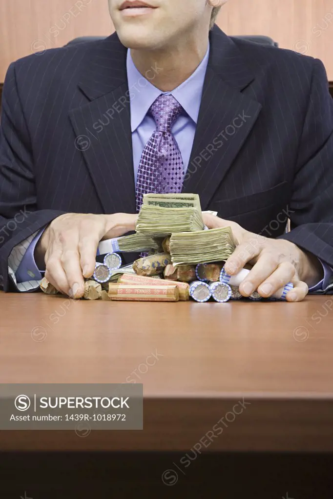 Businessman holding stack of money