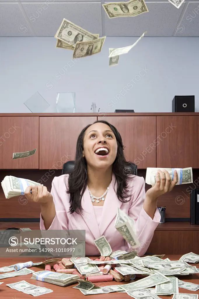 Businesswoman throwing money