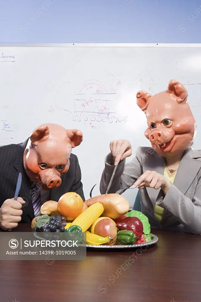 Businesspeople in pig masks with plastic food