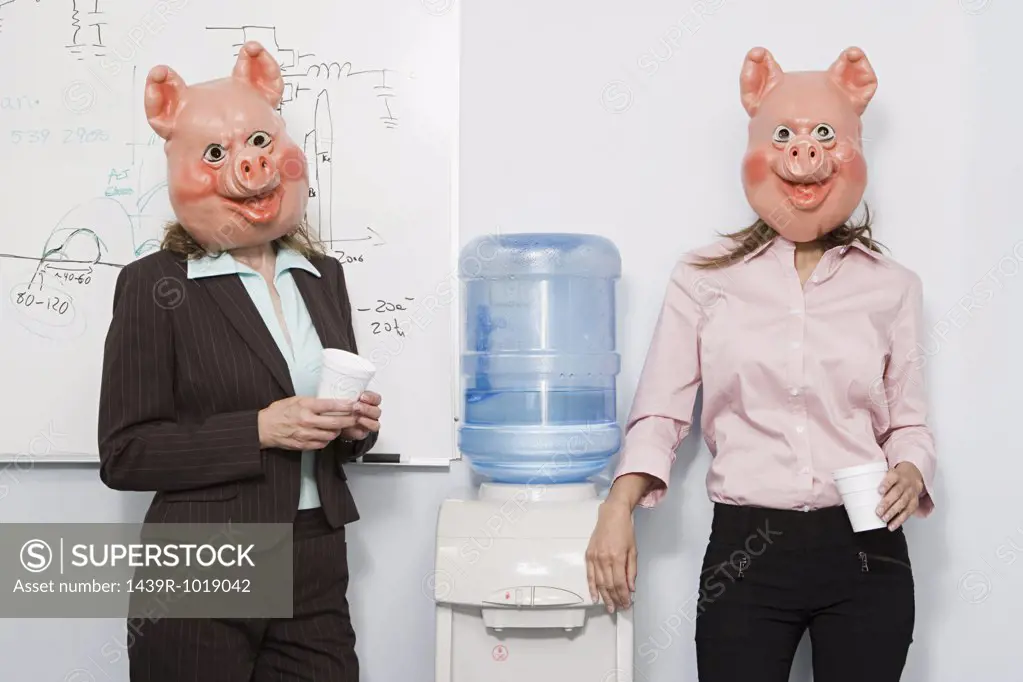 Two businesswoman in pig masks at a water cooler