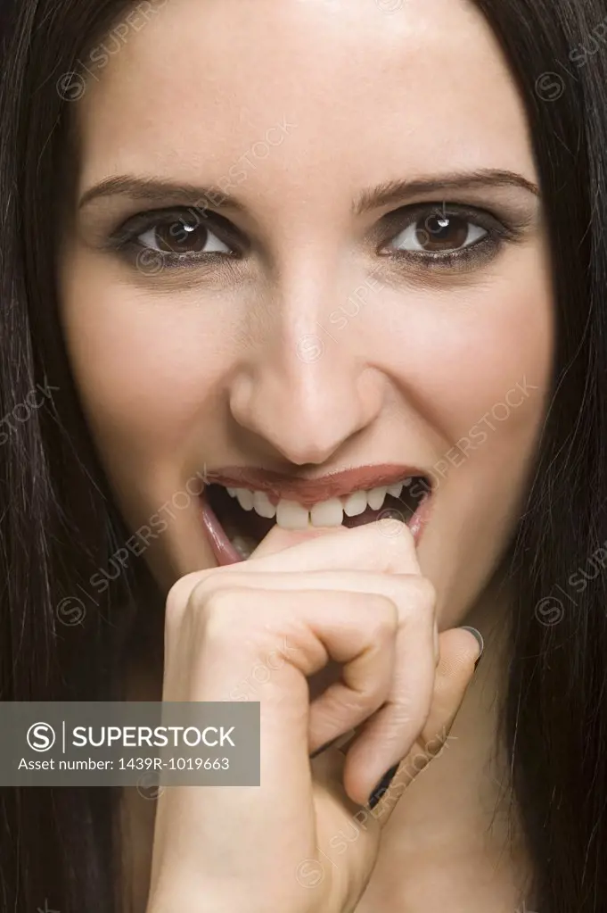 Woman biting her finger