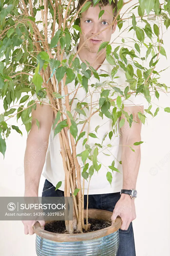 Man holding houseplant