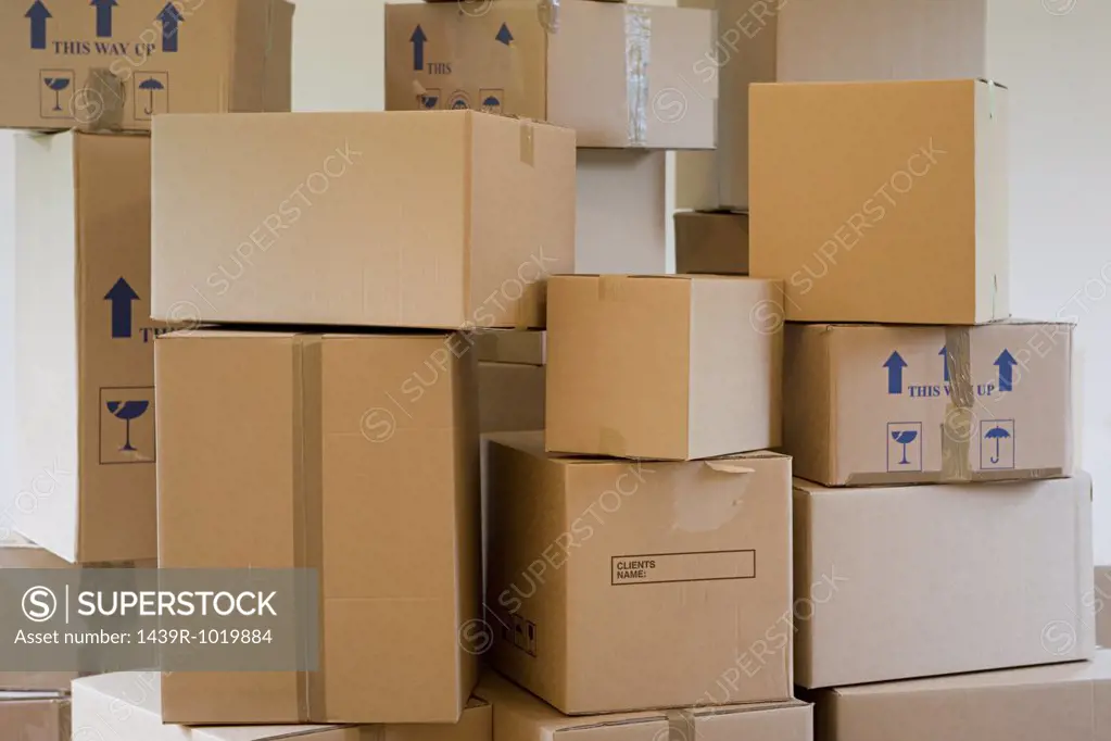 Stack of cardboard boxes in a room