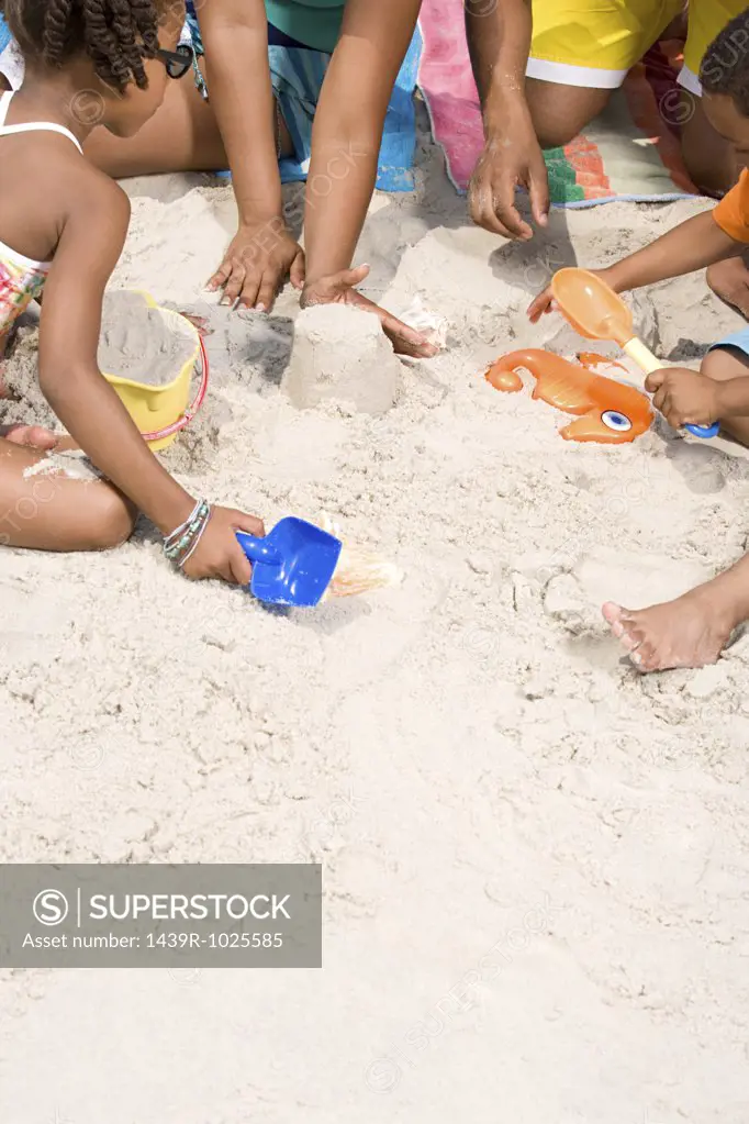 Family making sandcastles