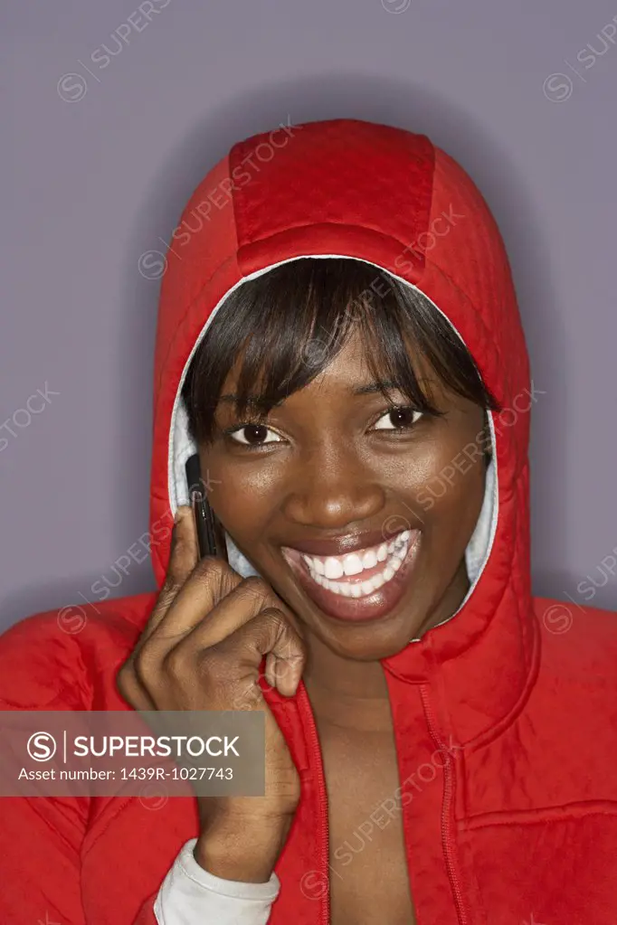 Woman in red jacket on cellphone