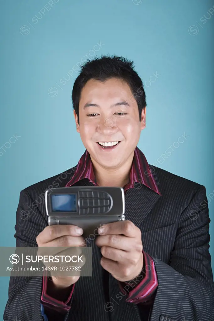 Businessman with handheld computer cellphone