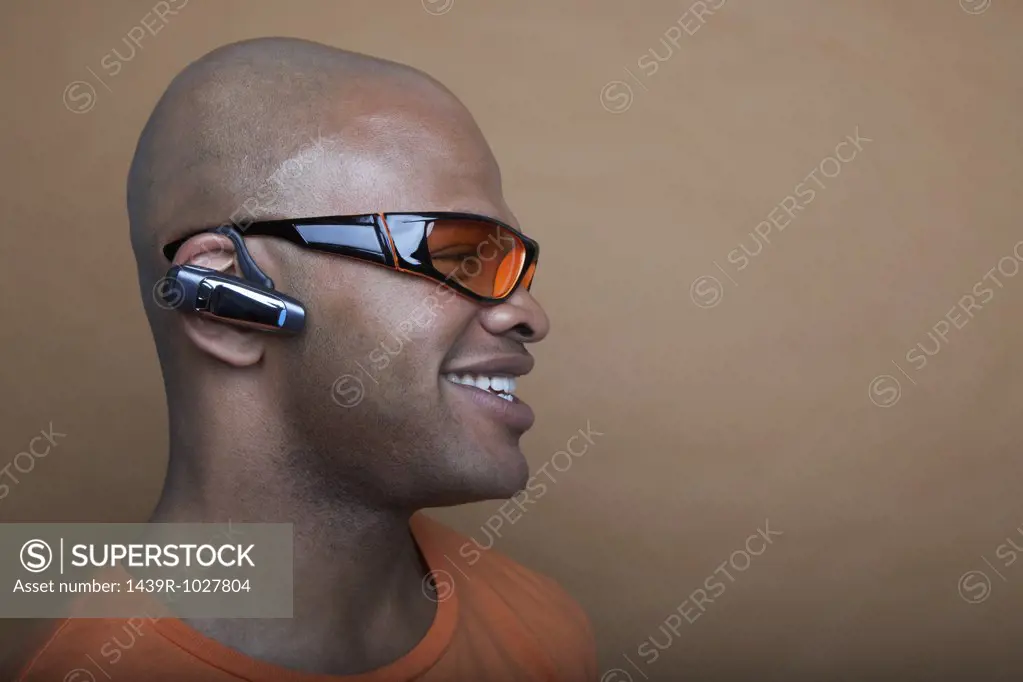 Man wearing sunglasses and headset