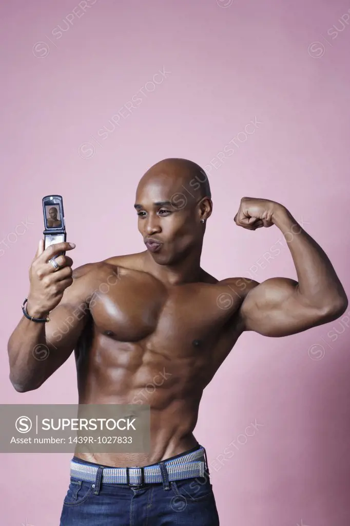 Man flexing his muscles for camera