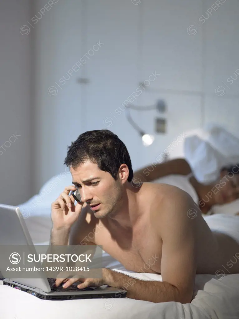 Man working as wife sleeps