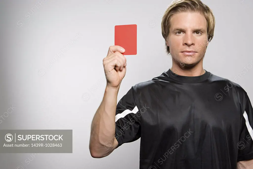 Referee holding red card