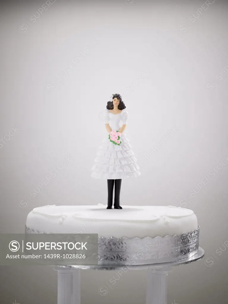 Bride figurine in a wedding dress and trousers