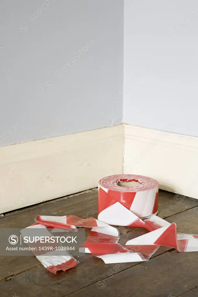 Cordon tape in corner of room
