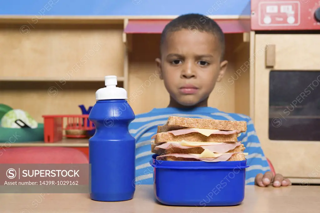 Boy looking at lunch box