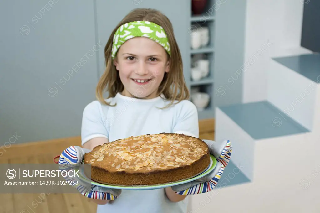 Girl holding an almond cake