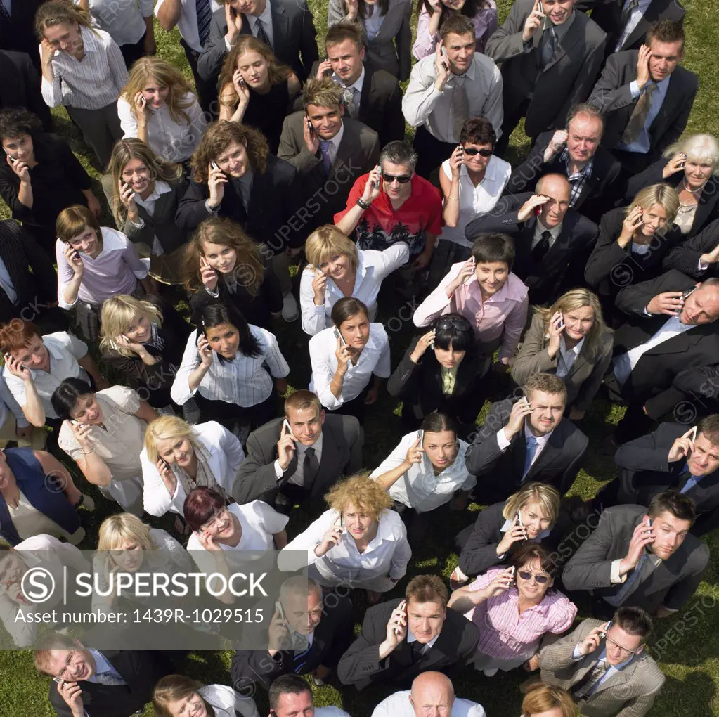 Businesspeople holding cell phones