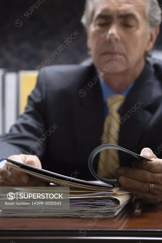 Businessman looking at file