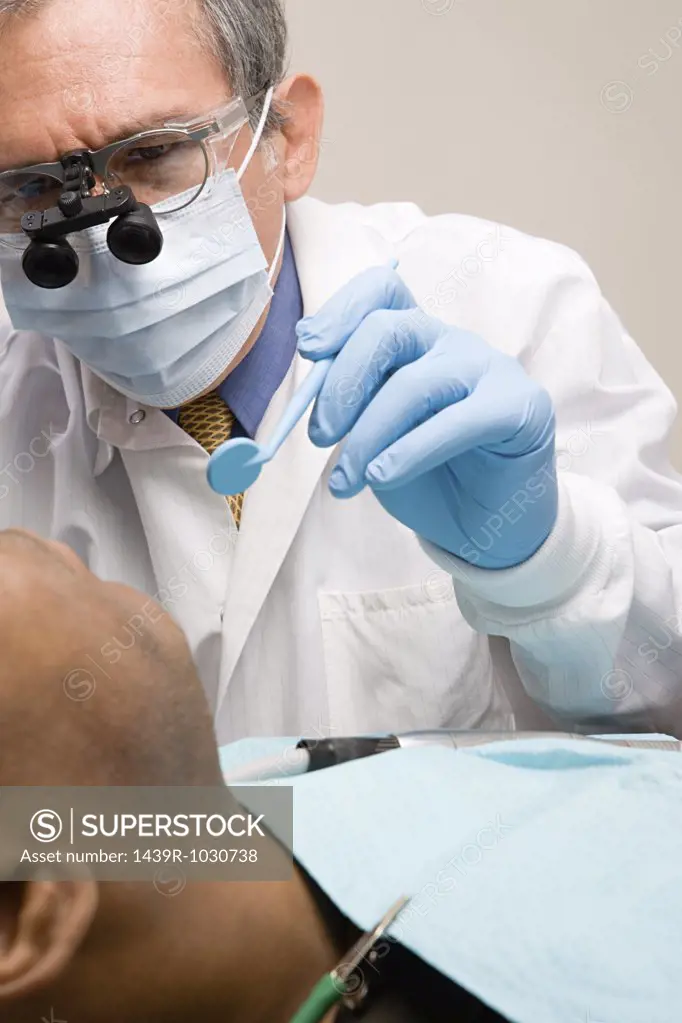 Man having teeth examined