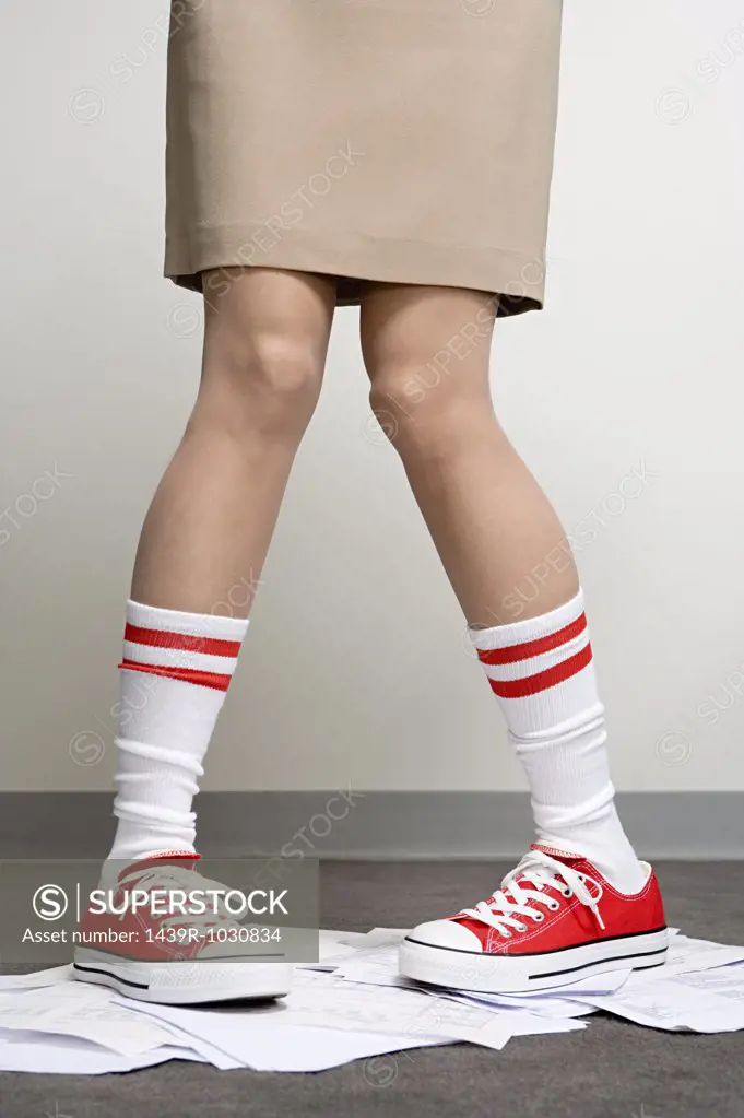 Female office worker wearing baseball boots