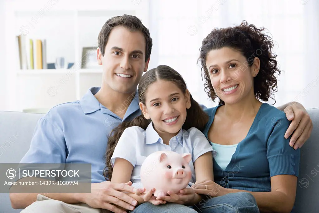 Family with a piggy bank