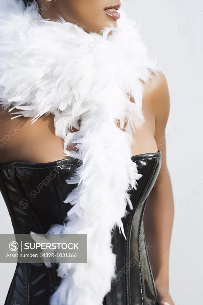 Woman wearing corset and feather boa