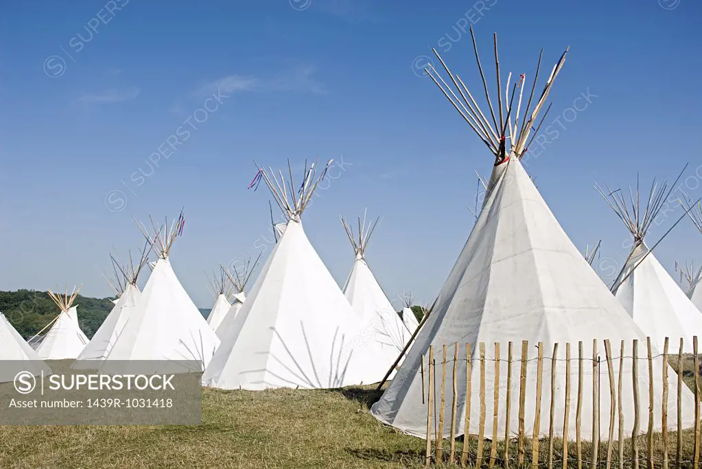 Teepees in a field